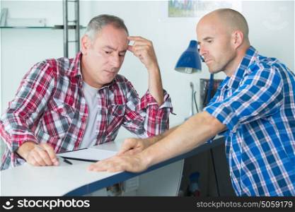 construction manager resolving a problem with colleague