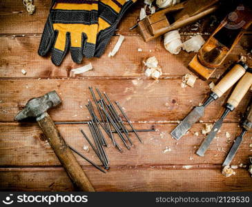 Construction nails on the table. On a wooden background. High quality photo. Construction nails on the table.