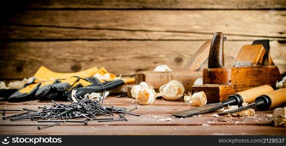 Construction nails on the table. On a wooden background. High quality photo. Construction nails on the table.