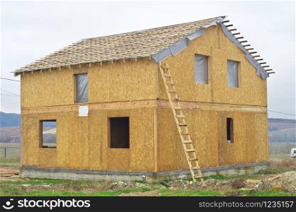 Construction of a wooden house of SIP panels. Element of building design.