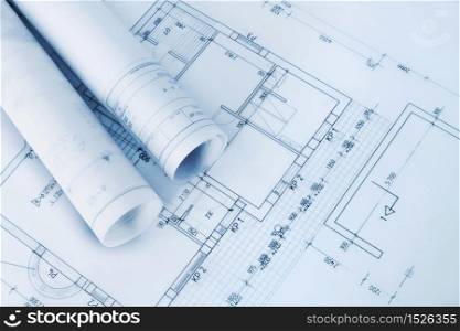 Construction plan blueprint rolls with drawings. Construction plan blueprints