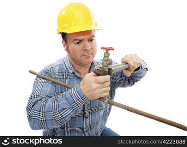 Construction plumber working on a faucet. Isolated on white.