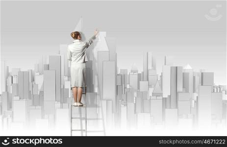 Construction project. Businesswoman standing on ladder with back and drawing project of city