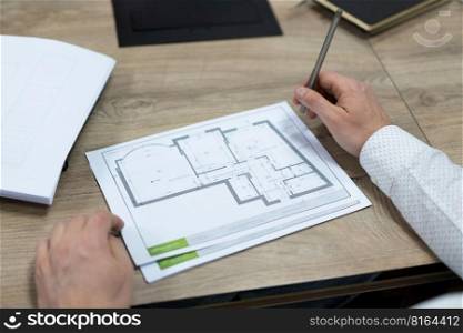 construction project drawings are discussed by construction company employees