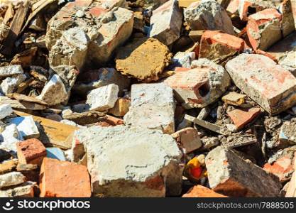 Construction site. Closeup of stack of old grunge destroyed damaged bricks. Industry.