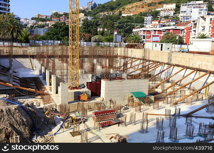 Construction site for equipping the foundation of a modern building. The concept of urban planning. Budva. Montenegro.. Construction site for the equip of the foundation of a modern building