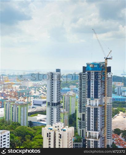 Construction site of modern skyscraper in progress. Singapore