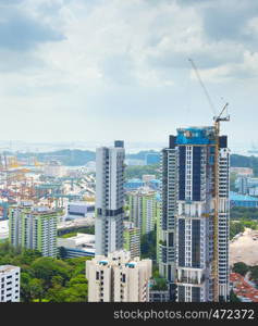 Construction site of modern skyscraper in progress. Singapore