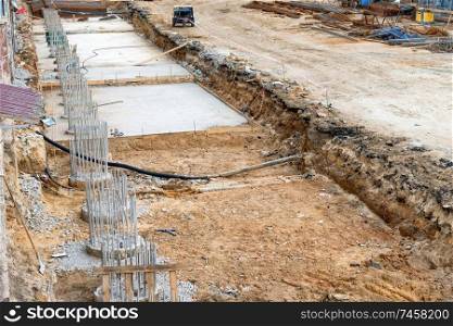 Construction site with building column from concrete