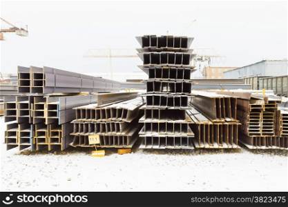 construction steel beams in outdoor warehouse in winter