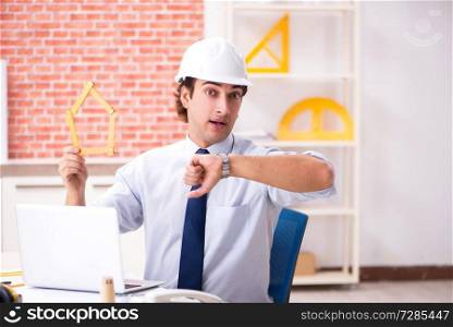 Construction supervisor working on blueprints