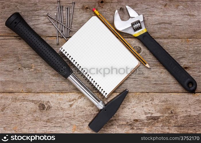 Construction tools and blank notebook for your text
