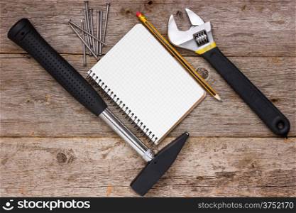 Construction tools and blank notebook for your text