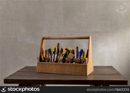 Construction tools and toolbox on wooden table background texture. Tools kit and tool box