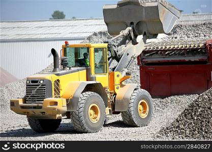 Construction vehicles transporting gravel