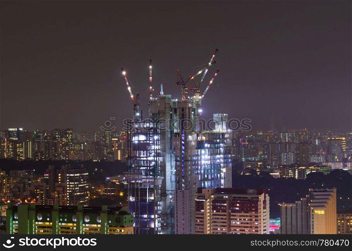 construction work skyscraper in Singapore city night. cityscape and building skyscraper.