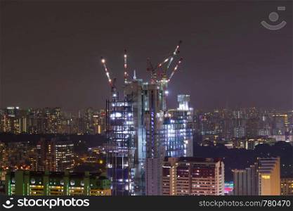 construction work skyscraper in Singapore city night. cityscape and building skyscraper.