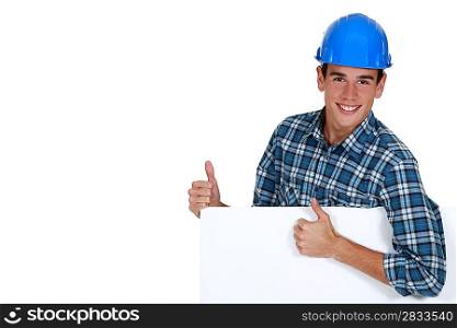Construction worker approving a board left blank for your message