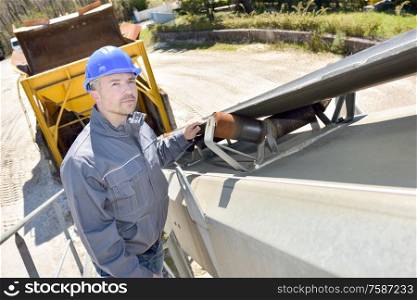 construction worker at the back of a lorry