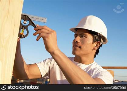 Construction Worker Building a House
