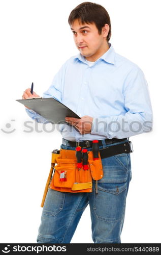 Construction worker checking something and writing in clipboard&#xA;