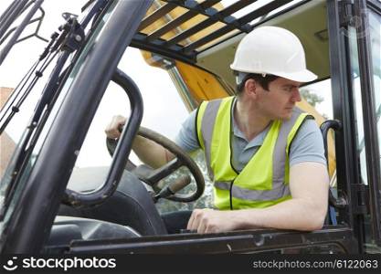 Construction Worker Driving Digger