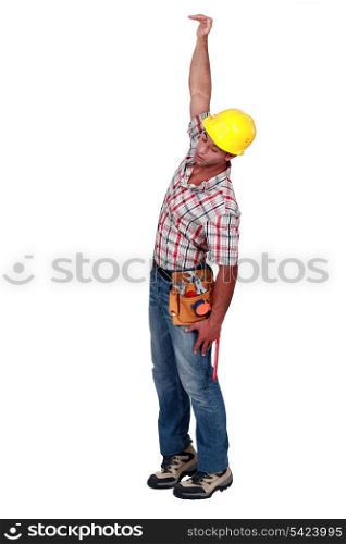 Construction worker hanging in empty space
