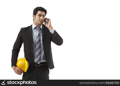 Construction worker having conversation on mobile phone