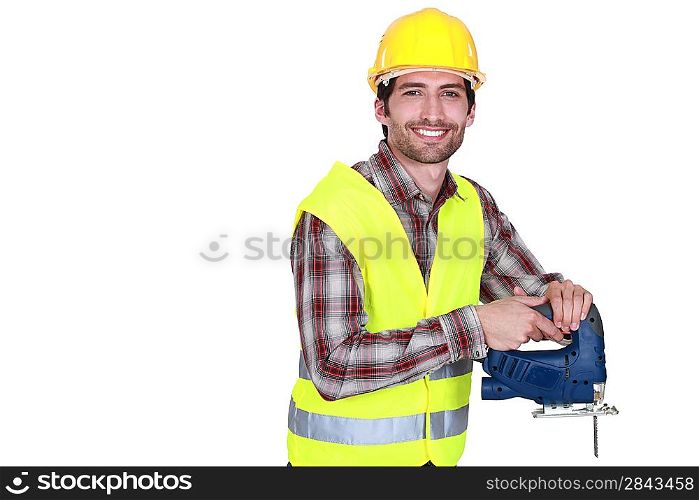 Construction worker holding a jigsaw