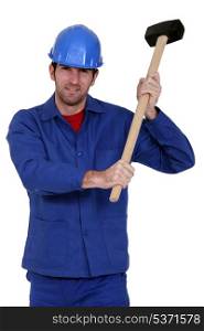 Construction worker holding a mallet