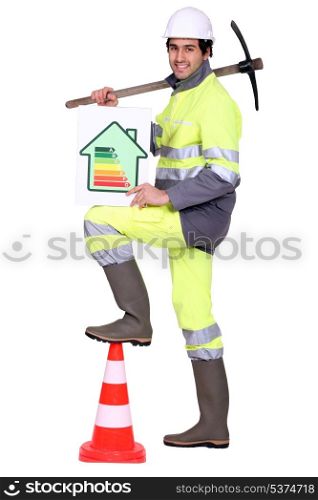 Construction worker holding a pickaxe
