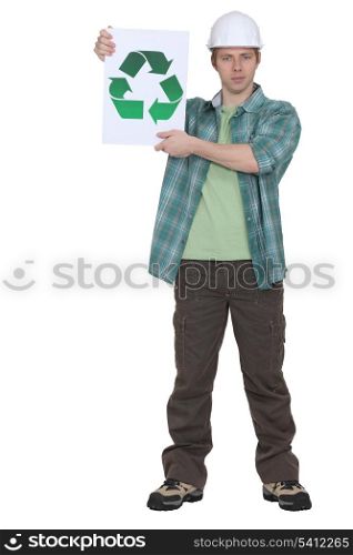 Construction worker holding a recycle sign