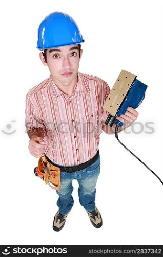 Construction worker holding a sander.