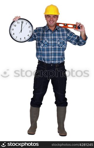 Construction worker holding clock