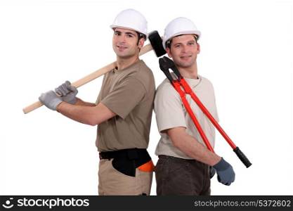 Construction worker holding heavy-duty tools