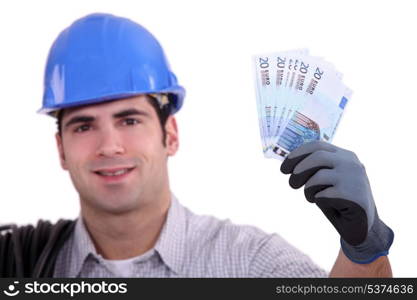 Construction worker holding money