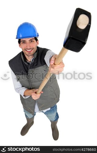 Construction worker holding up a mallet