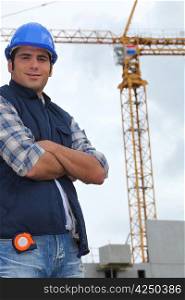 Construction worker in front of a crane