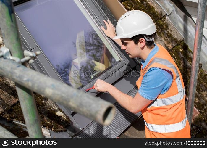 Construction Worker Installing Replacement Window