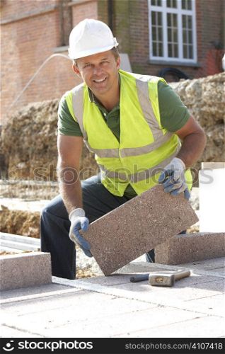 Construction Worker Laying Blockwork