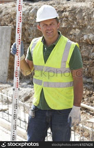 Construction Worker Laying Foundations