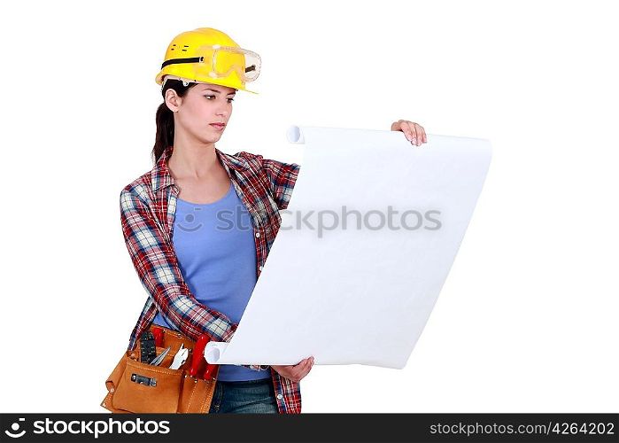 Construction worker looking at plans