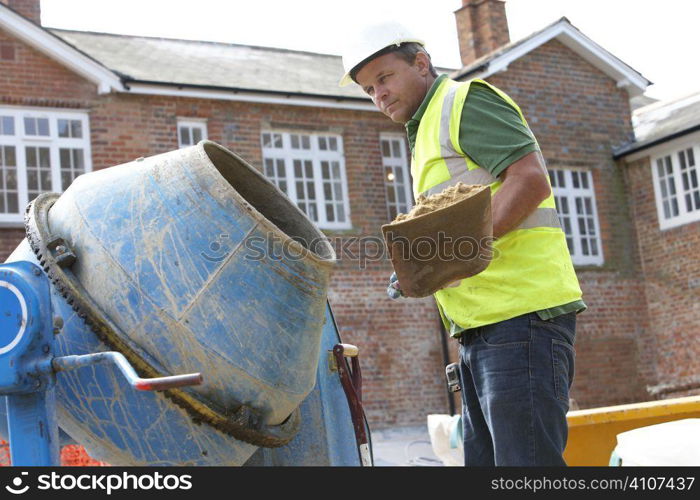 Construction Worker Mixing Cement