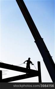 Construction worker on framework