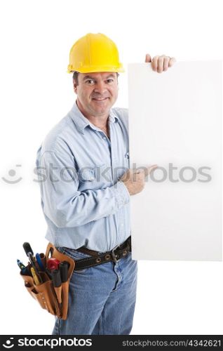 Construction worker pointing to a blank white sign. Isolated.