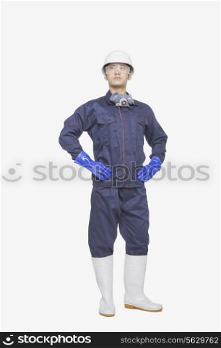 Construction worker posing against white background, portrait