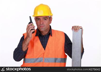 Construction worker transmitting radio