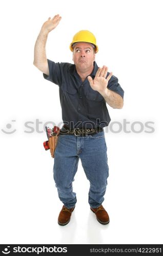 Construction worker trapped in imaginary box. Full body isolated on white.