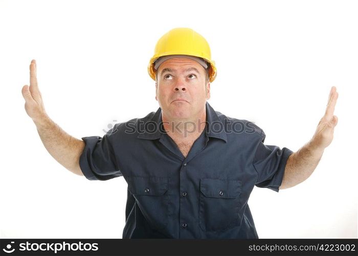Construction worker trapped in the middle between two objects or ideas and looking to heaven for help. Isolated on white.
