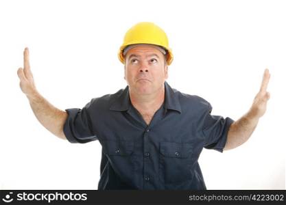 Construction worker trapped in the middle between two objects or ideas and looking to heaven for help. Isolated on white.